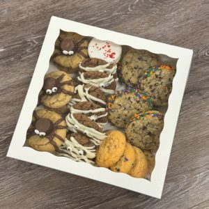 box of cookies in a white box with clear top closed